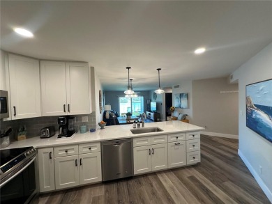 One of the BEST condo remodels in Isla Del Sol!  Photos do not on Isla Del Sol Yacht and Country Club in Florida - for sale on GolfHomes.com, golf home, golf lot