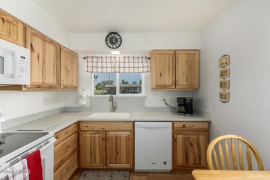 Welcome home to this charming end unit in the active adult Sun on  in Arizona - for sale on GolfHomes.com, golf home, golf lot