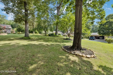 Set on a prime corner lot in the heart of Tellico Village, this on Toqua Golf Course - Loudon County in Tennessee - for sale on GolfHomes.com, golf home, golf lot