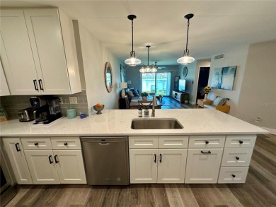 One of the BEST condo remodels in Isla Del Sol!  Photos do not on Isla Del Sol Yacht and Country Club in Florida - for sale on GolfHomes.com, golf home, golf lot