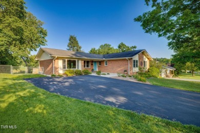 Welcome home to this one level brick beauty with a basement! on Johnson City Country Club in Tennessee - for sale on GolfHomes.com, golf home, golf lot