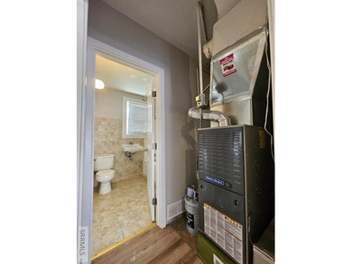 Charming and affordable 3-bedroom, 1-bath home tucked just off on  in  - for sale on GolfHomes.com, golf home, golf lot