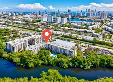 This exceptional corner unit comes with 2 cover parking spaces on Greynolds Park Golf Course in Florida - for sale on GolfHomes.com, golf home, golf lot