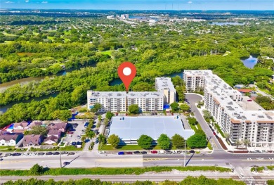 This exceptional corner unit comes with 2 cover parking spaces on Greynolds Park Golf Course in Florida - for sale on GolfHomes.com, golf home, golf lot