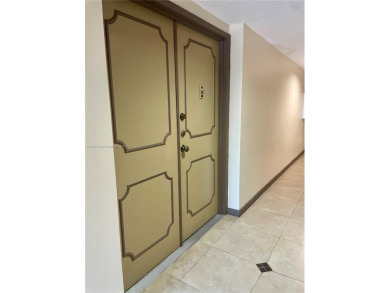 This exceptional corner unit comes with 2 cover parking spaces on Greynolds Park Golf Course in Florida - for sale on GolfHomes.com, golf home, golf lot