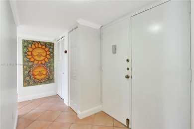 This exceptional corner unit comes with 2 cover parking spaces on Greynolds Park Golf Course in Florida - for sale on GolfHomes.com, golf home, golf lot