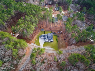 Welcome to this stunning & charming farmhouse-style home on River Golf and County Club at Lake Royale in North Carolina - for sale on GolfHomes.com, golf home, golf lot