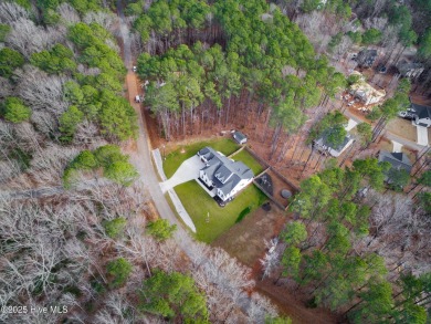 Welcome to this stunning & charming farmhouse-style home on River Golf and County Club at Lake Royale in North Carolina - for sale on GolfHomes.com, golf home, golf lot