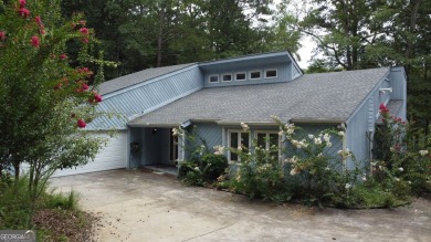 This 3 bed, 2 bath single-story home sits on the smaller fishing on Fairfield Plantation Golf and Country Club in Georgia - for sale on GolfHomes.com, golf home, golf lot