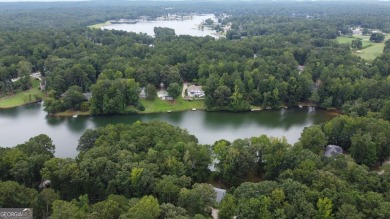 This 3 bed, 2 bath single-story home sits on the smaller fishing on Fairfield Plantation Golf and Country Club in Georgia - for sale on GolfHomes.com, golf home, golf lot