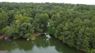This 3 bed, 2 bath single-story home sits on the smaller fishing on Fairfield Plantation Golf and Country Club in Georgia - for sale on GolfHomes.com, golf home, golf lot