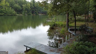 This 3 bed, 2 bath single-story home sits on the smaller fishing on Fairfield Plantation Golf and Country Club in Georgia - for sale on GolfHomes.com, golf home, golf lot