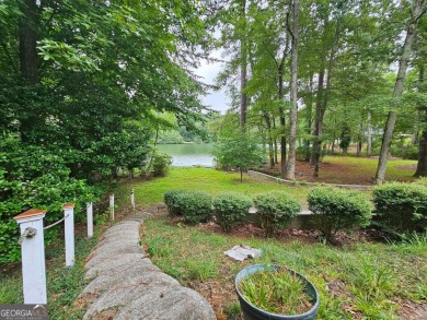 This 3 bed, 2 bath single-story home sits on the smaller fishing on Fairfield Plantation Golf and Country Club in Georgia - for sale on GolfHomes.com, golf home, golf lot