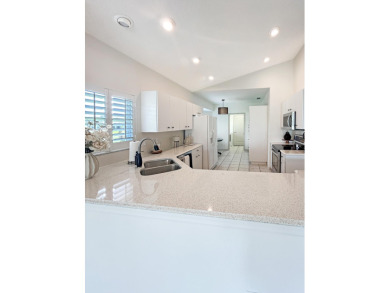 This beautifully renovated single family home features an open on Capri Isle Golf Club in Florida - for sale on GolfHomes.com, golf home, golf lot