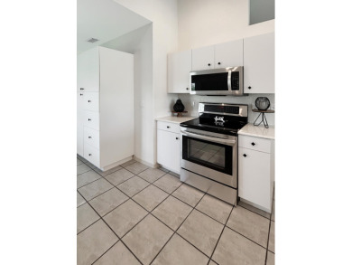 This beautifully renovated single family home features an open on Capri Isle Golf Club in Florida - for sale on GolfHomes.com, golf home, golf lot