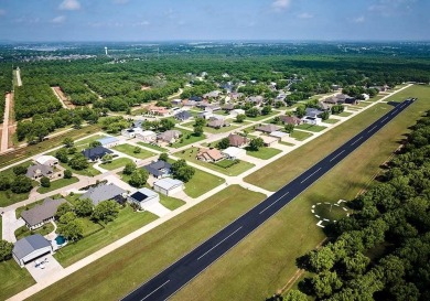 A spacious 1.9 acre lot located on the edge of The Retreat area on Pecan Plantation Country Club in Texas - for sale on GolfHomes.com, golf home, golf lot