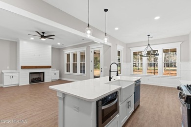 Beautiful new construction home located across from the waterway on Oyster Bay Golf Links in North Carolina - for sale on GolfHomes.com, golf home, golf lot