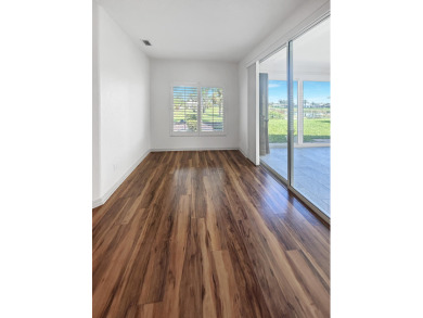 This beautifully renovated single family home features an open on Capri Isle Golf Club in Florida - for sale on GolfHomes.com, golf home, golf lot