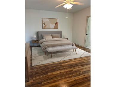 This beautifully renovated single family home features an open on Capri Isle Golf Club in Florida - for sale on GolfHomes.com, golf home, golf lot