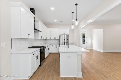 Beautiful new construction home located across from the waterway on Oyster Bay Golf Links in North Carolina - for sale on GolfHomes.com, golf home, golf lot