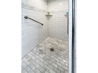 This beautifully renovated single family home features an open on Capri Isle Golf Club in Florida - for sale on GolfHomes.com, golf home, golf lot