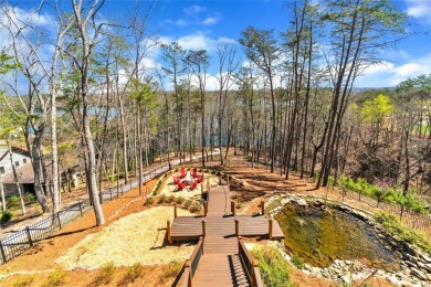 Welcome to this magnificent lakeside retreat located on Lake on The Highlands Course at Lake Arrowhead in Georgia - for sale on GolfHomes.com, golf home, golf lot