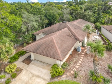 Experience carefree living in this stunning one-level residence on Sugar Mill Country Club in Florida - for sale on GolfHomes.com, golf home, golf lot