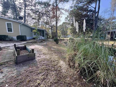 Coastal Living at Its Best! Charming 2 Bed / 2 Bath Beach on Indigo Creek Golf Club in South Carolina - for sale on GolfHomes.com, golf home, golf lot