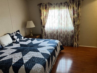 This home needs a little TLC and is priced at $25,000 for a on Pine Lakes Country Club in Florida - for sale on GolfHomes.com, golf home, golf lot