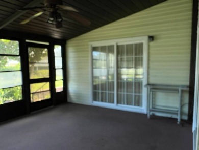 This home needs a little TLC and is priced at $25,000 for a on Pine Lakes Country Club in Florida - for sale on GolfHomes.com, golf home, golf lot