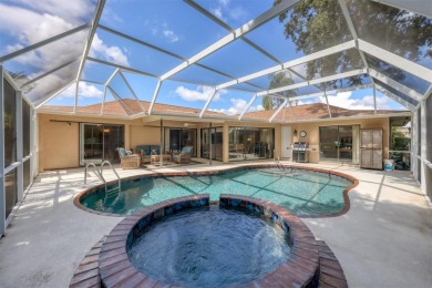 Tranquil, updated, solid-block pool home with distant golf on The Meadows Golf and Country Club in Florida - for sale on GolfHomes.com, golf home, golf lot