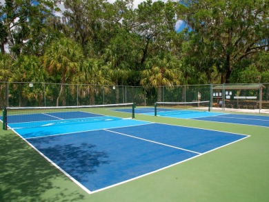 Tranquil, updated, solid-block pool home with distant golf on The Meadows Golf and Country Club in Florida - for sale on GolfHomes.com, golf home, golf lot