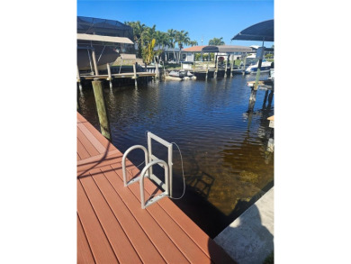 Welcome to your luxury waterfront oasis in Cape Coral! This on Royal Tee Country Club in Florida - for sale on GolfHomes.com, golf home, golf lot