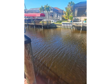 Welcome to your luxury waterfront oasis in Cape Coral! This on Royal Tee Country Club in Florida - for sale on GolfHomes.com, golf home, golf lot