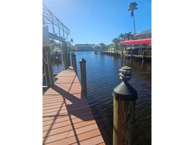 Welcome to your luxury waterfront oasis in Cape Coral! This on Royal Tee Country Club in Florida - for sale on GolfHomes.com, golf home, golf lot