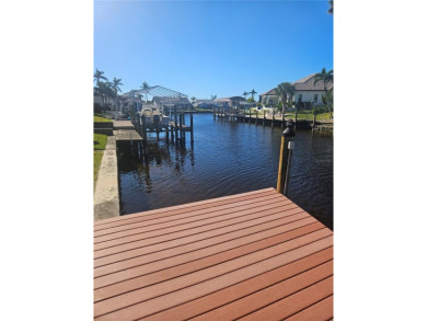 Welcome to your luxury waterfront oasis in Cape Coral! This on Royal Tee Country Club in Florida - for sale on GolfHomes.com, golf home, golf lot