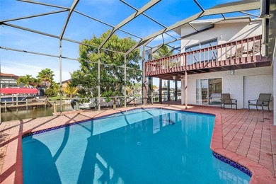 mAJOR RICE REDUCTION! Welcome to your luxury waterfront oasis in on Royal Tee Country Club in Florida - for sale on GolfHomes.com, golf home, golf lot