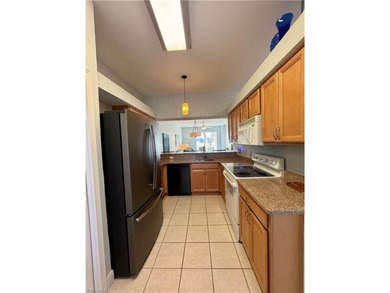 This light and bright 2-bedroom plus den, 2-bath residence on Stoneybrook Golf Club in Florida - for sale on GolfHomes.com, golf home, golf lot