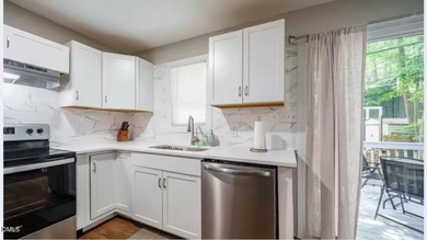 Beautifully updated 4-bedroom, 2-bath home in the highly on Twin Lakes Golf Course in North Carolina - for sale on GolfHomes.com, golf home, golf lot