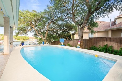Welcome to 2110 Harbor Ct, a custom waterfront retreat located on Rockport Country Club in Texas - for sale on GolfHomes.com, golf home, golf lot