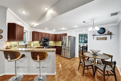 SHOWINGS BEGIN AT OPEN HOUSE ON SATURDAY, MARCH 14 FROM 12-3 PM! on Pine Island Ridge Country Club in Florida - for sale on GolfHomes.com, golf home, golf lot