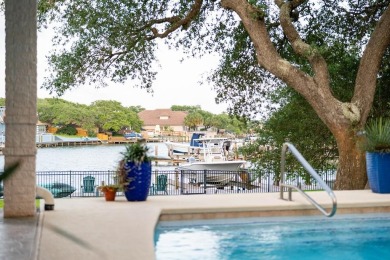 Welcome to 2110 Harbor Ct, a custom waterfront retreat located on Rockport Country Club in Texas - for sale on GolfHomes.com, golf home, golf lot