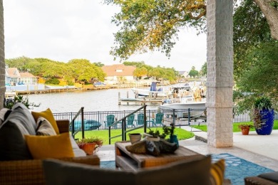 Welcome to 2110 Harbor Ct, a custom waterfront retreat located on Rockport Country Club in Texas - for sale on GolfHomes.com, golf home, golf lot