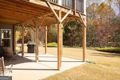 Discover relaxed, resort-style living in this charming on Lanier Island Legacy Golf Couorse in Georgia - for sale on GolfHomes.com, golf home, golf lot