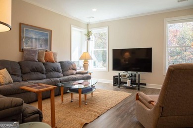 Discover relaxed, resort-style living in this charming on Lanier Island Legacy Golf Couorse in Georgia - for sale on GolfHomes.com, golf home, golf lot