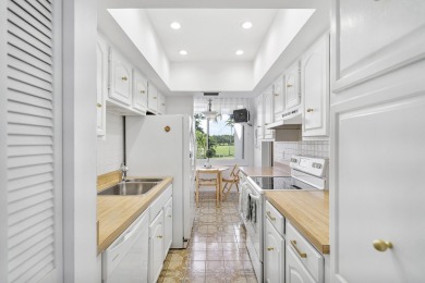 This beautiful condominium in Boca West is just steps away from on Boca West Golf and Country Club in Florida - for sale on GolfHomes.com, golf home, golf lot