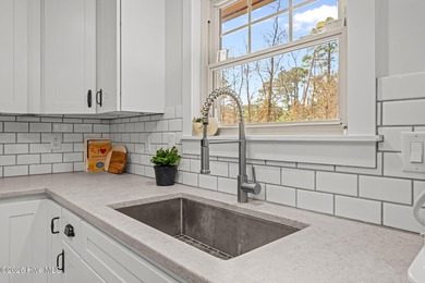 Feel instantly at home as you step into this bright, open on Harbour Point Golf Club in North Carolina - for sale on GolfHomes.com, golf home, golf lot