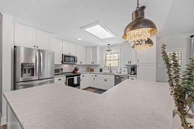 Feel instantly at home as you step into this bright, open on Harbour Point Golf Club in North Carolina - for sale on GolfHomes.com, golf home, golf lot