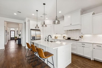 This stunning home features high end finishes, built by Britton on The Tribute At the Colony in Texas - for sale on GolfHomes.com, golf home, golf lot