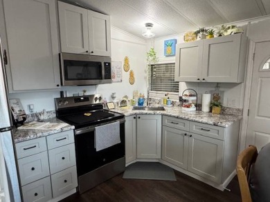 This 2-bedroom, 2-bath home has been remodeled in the last year on Grasslands Golf and Country Club in Florida - for sale on GolfHomes.com, golf home, golf lot